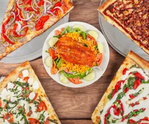 salad with BBQ chicken, assorted pizza slices