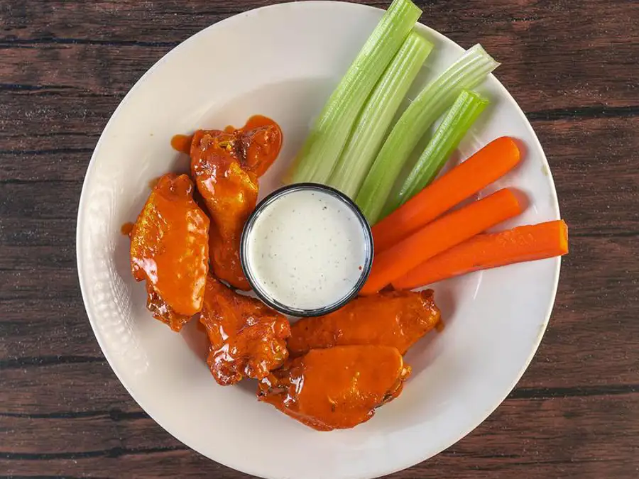 BBQ chiicken wings with celery and carrots